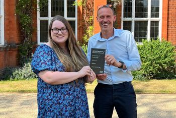 Meet Cambridge’s sustainability lead, Sarah Maycock (left) and Andrew Bell, Head of Meet Cambridge (right) collect the Green Impact Award